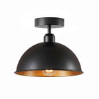 Matte black exterior with a reflective gold/brass inner dome