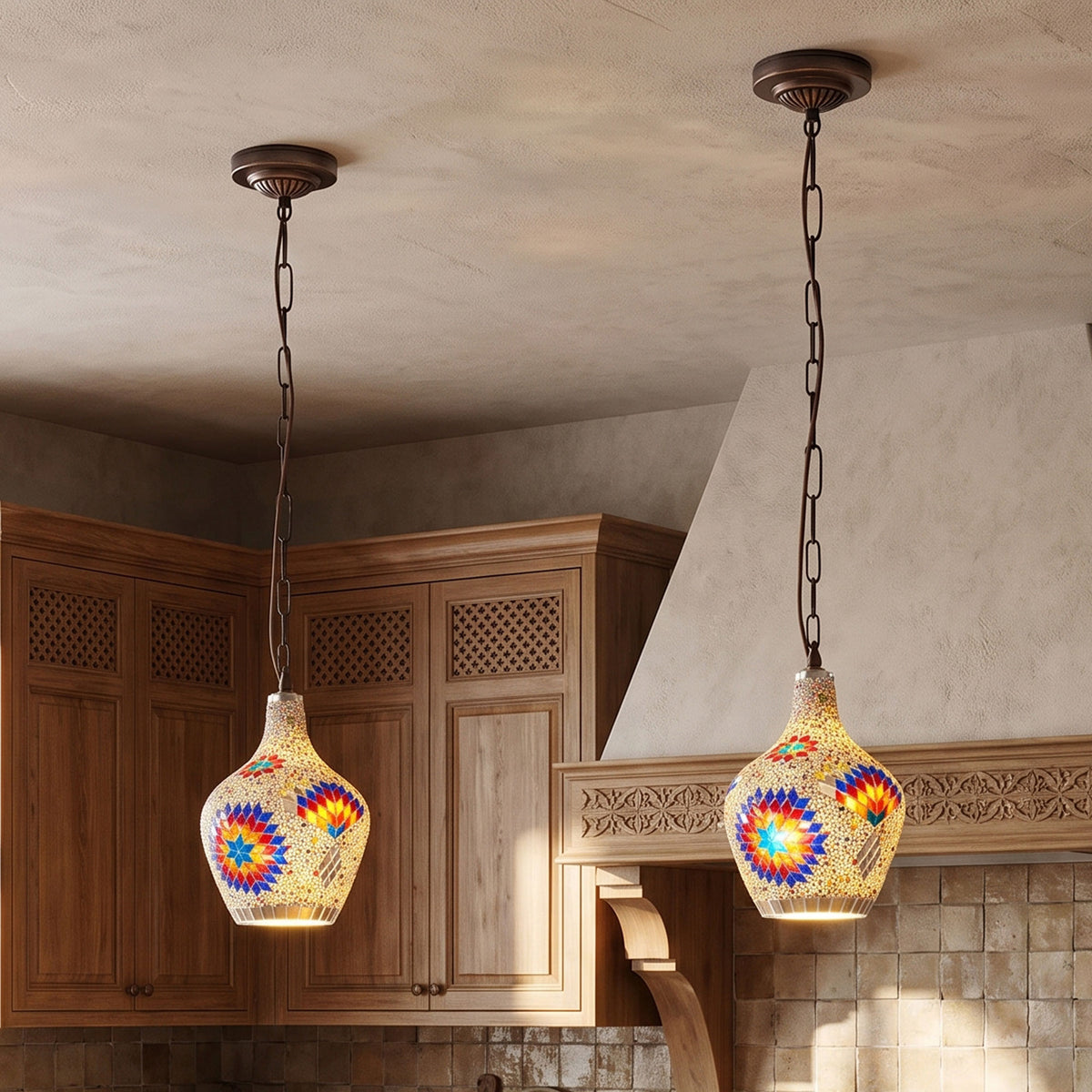 Two mosaic pendant lights with colorful stained-glass-style floral patterns hang from dark metal chains in a kitchen setting with wooden cabinets and a textured beige ceiling.