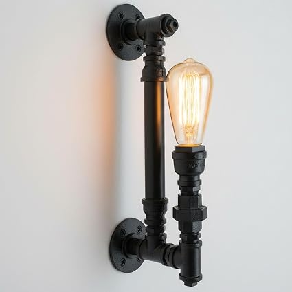 Wall-mounted industrial-style light fixture with a glowing bulb on a plain background