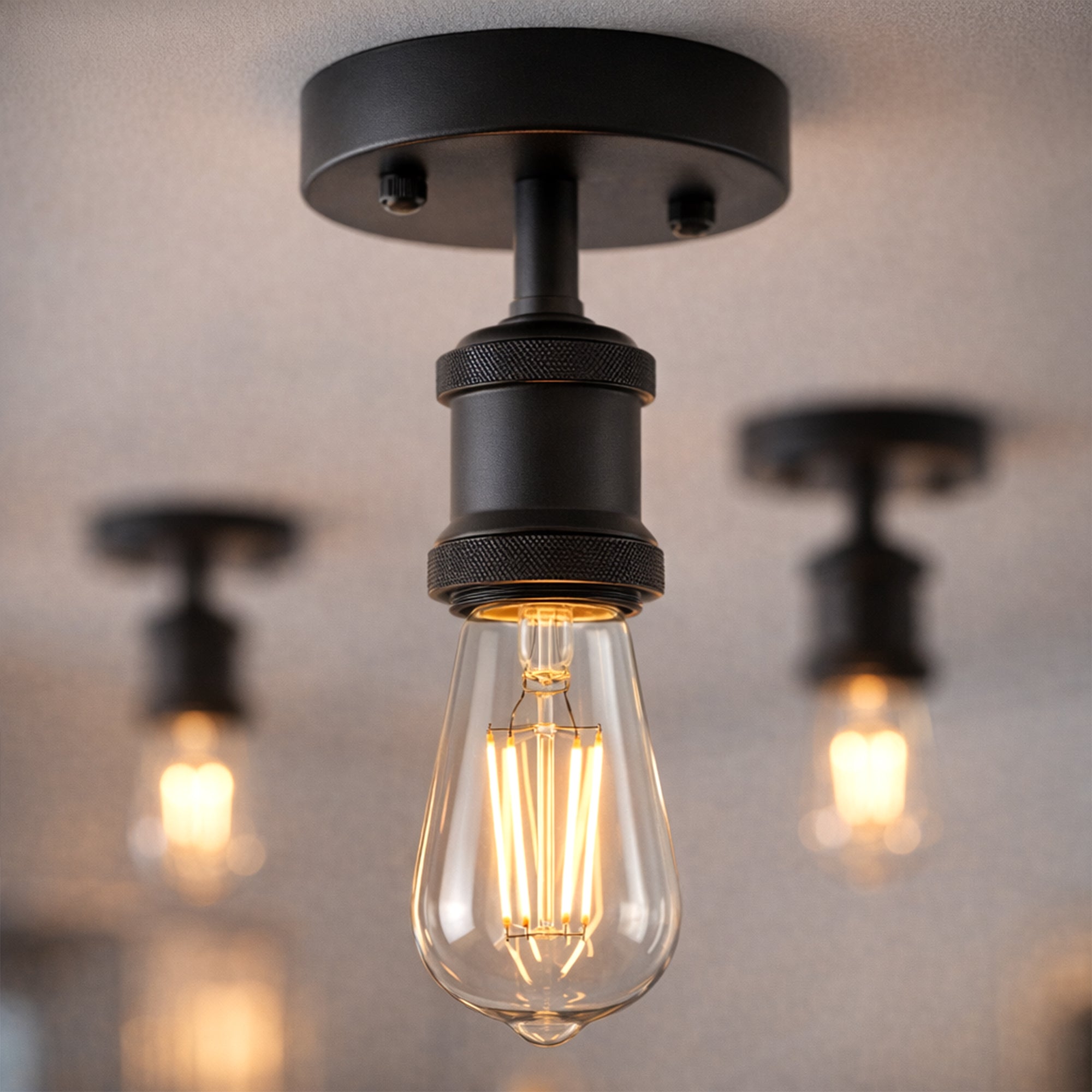 Vintage black metal flush-mount ceiling light holder in a modern kitchen.