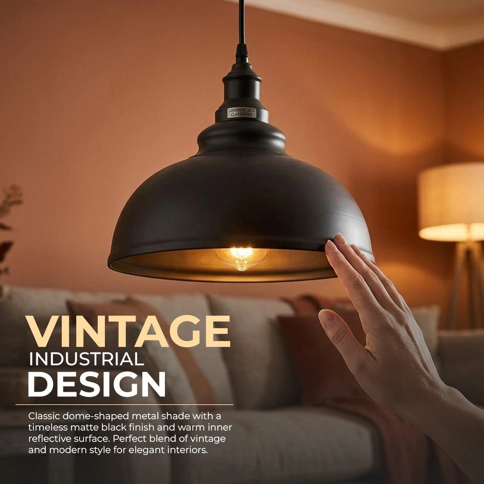 Black pendant light with a hand touching it, set against a warm-toned living room background.