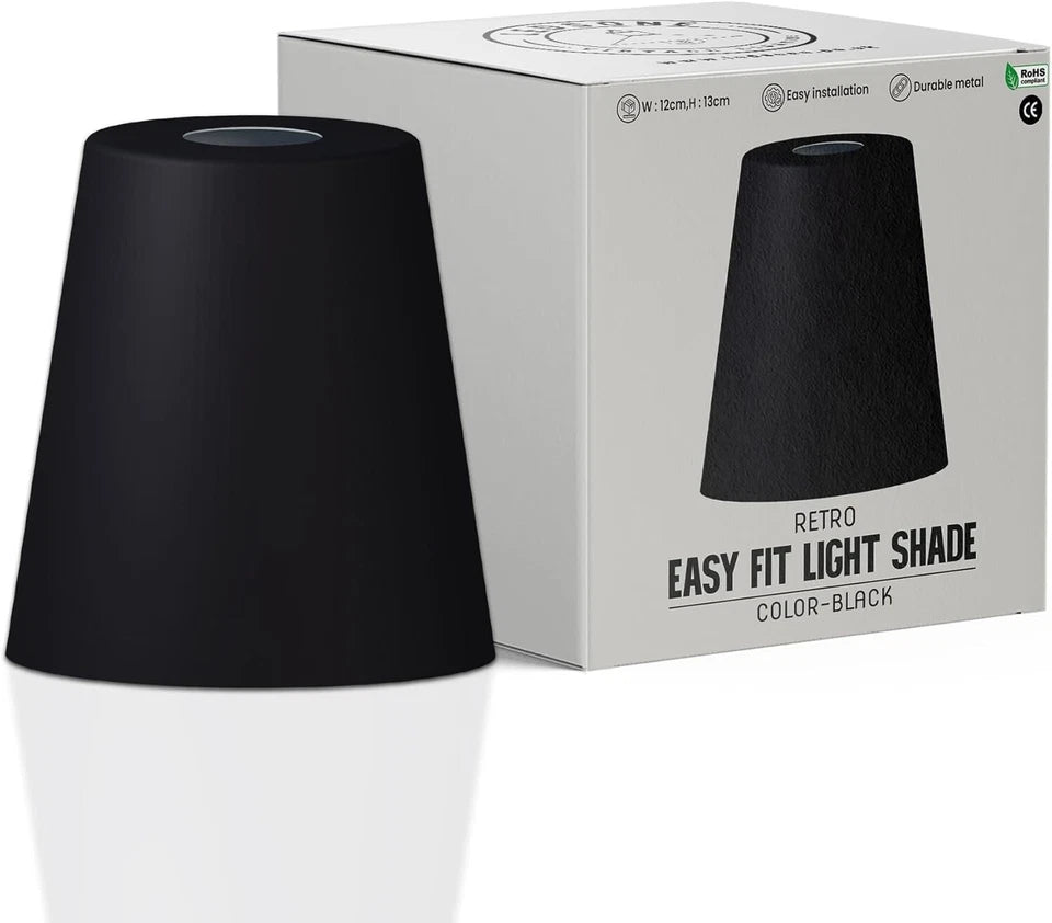 A black metal shade sits next to its white packaging.