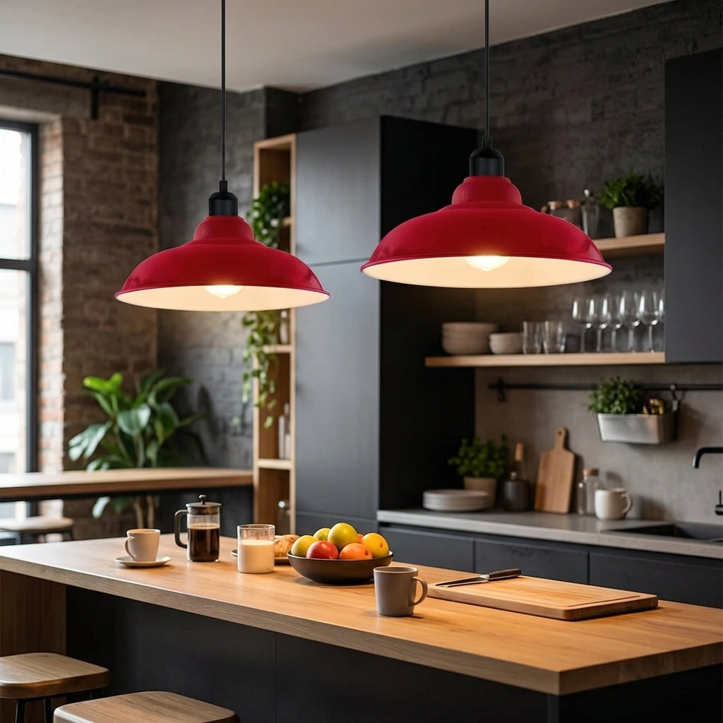 Two red pendant lights hang over a modern kitchen island with a wooden countertop, dark cabinetry, and kitchen accessories in a real indoor environment.